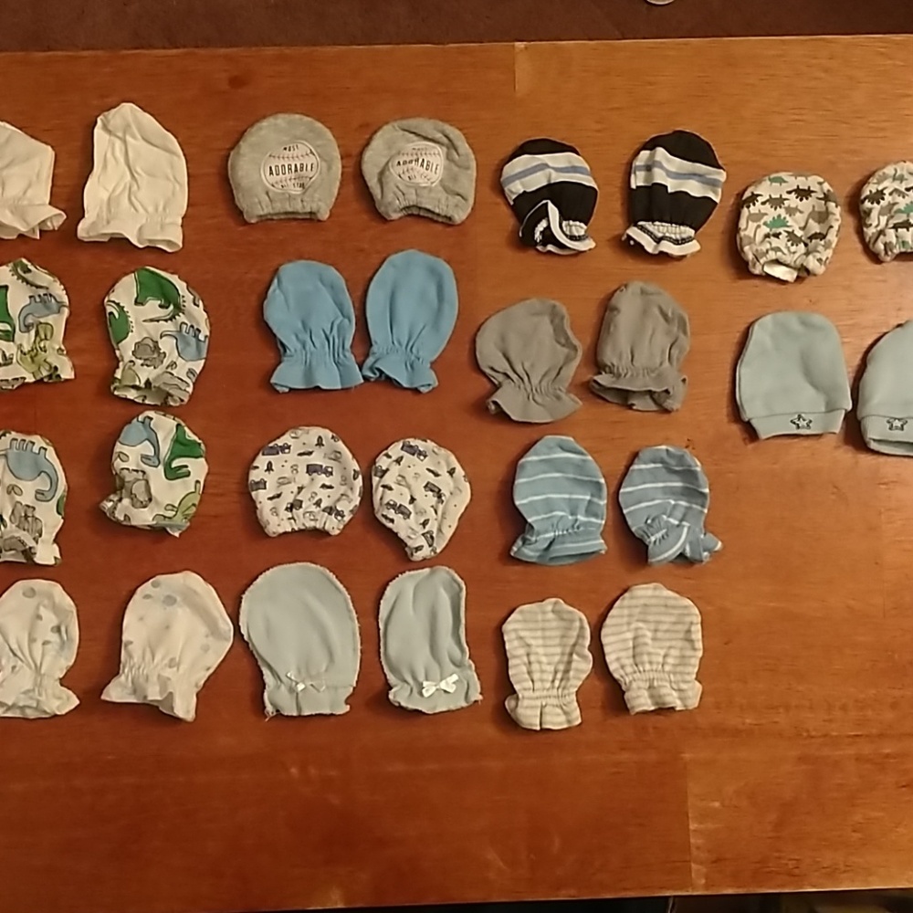 14 pairs of baby mittens